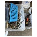 Bin of extension chords and adjustable clamp.