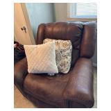 Comfy recliner with some wear on arms and pillows