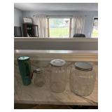 Jars with lids, syrup container and drinking cup