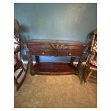 Victorian themed side table with ornate details.
