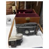 Vintage Polaroid land camera with flash and bag