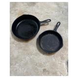 2 unmarked cast iron skillets