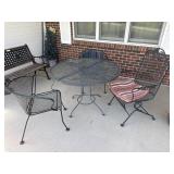 Cast-iron outdoor table with three chairs