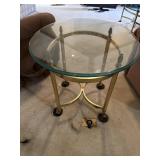Glass and brass oval end table