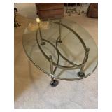 Glass and brass oval coffee table
