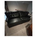 Black vinyl couch.