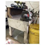 Work bench on wheels. Item on bench not included.