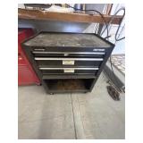Black 3 drawer Craftsmen tool storage on wheels.
