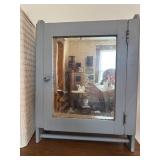 Primitive medicine cabinet with towel rack and