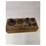 Solid brass weights for a scale.