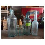 5 Aqua Glass Bottles of Various Sizes