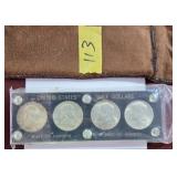 Two United States Half Dollars in Display Case