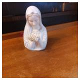 Porcelain Figurine of a Woman Holding Flowers