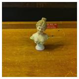 Porcelain Figurine of Woman in Green Dress
