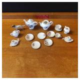 Miniature Porcelain Tea Set with Dog Figurine