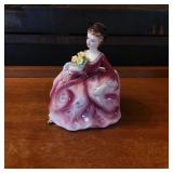 Ceramic Figurine of Woman Holding Flowers
