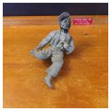 Painted Metal Figurine of a Sitting Man