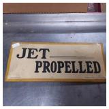 Metal Sign with ï¿½Jet Propelledï¿½ Text