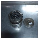 Glass Jar Filled With Shark Teeth
