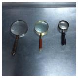 Three Magnifying Glasses with Varying Handles