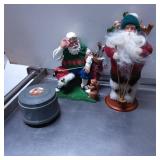Two Santa Claus Figurines with Accessories and Mus