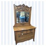 Ornate Wooden Dresser with Mirror and Carved Detai