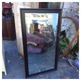 Black Framed Mirror Measuring 53 1/2 x 29 1/4 Inch