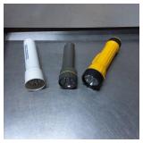 Three Handheld Flashlights in Various Colors and D