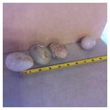 3 Polished Stone Eggs and 1 Wax-Like Material Egg