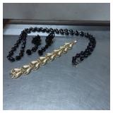 Black Necklace, Black Earrings, and Gold-Tone Brac