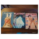 Three Playboy Magazines Featuring Various Covers