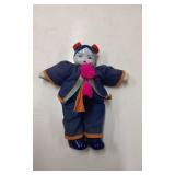 Porcelain Doll with Textile Outfit and Painted Fea