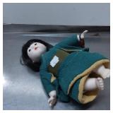 Plastic Doll in Traditional Green Outfit
