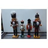 Four Wooden Nutcracker Figures in Various Sizes