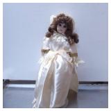 Porcelain Doll with Satin Outfit and Lace Detailin