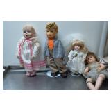 Four Assorted Dolls in Varied Styles and Sizes