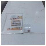 Stamps and Commemorative Coin in Protective Packag