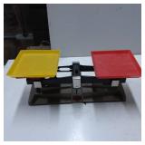 Dual-Pan Balance Scale with Yellow and Red Trays