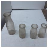 Four Vintage Clear Glass Milk Bottles in Assorted