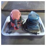 Two Electric Handheld Orbital Sanders in Red and B