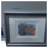 Framed Print Artwork Featuring a Red Brick Structu