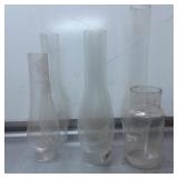 Four Clear Glass Lamp Chimneys with Varying Height