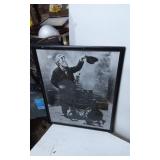 Framed Black-and-White Photograph of a Street Perf