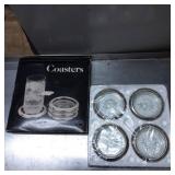 Four Glass and Metal Rimmed Coasters in Original P