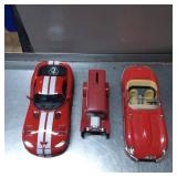 Three Red Die-Cast Model Cars