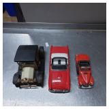 Three Die-Cast Vehicle Models Featuring a Tractor