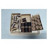 Spools of Thread in Varied Colors and Sizes