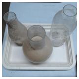 Three Clear Glass Chimneys of Varying Shapes and S