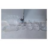 Clear Glassware Including Bowls, Plates, and a Cov