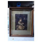 Framed Print Depicting a Young Girl Holding a Dog
